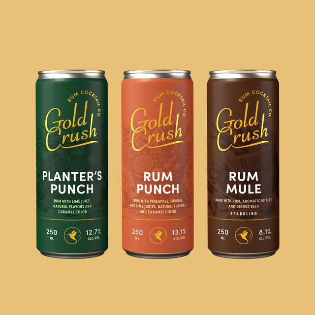 Three cans of Gold Crush rum cocktails on a beige background